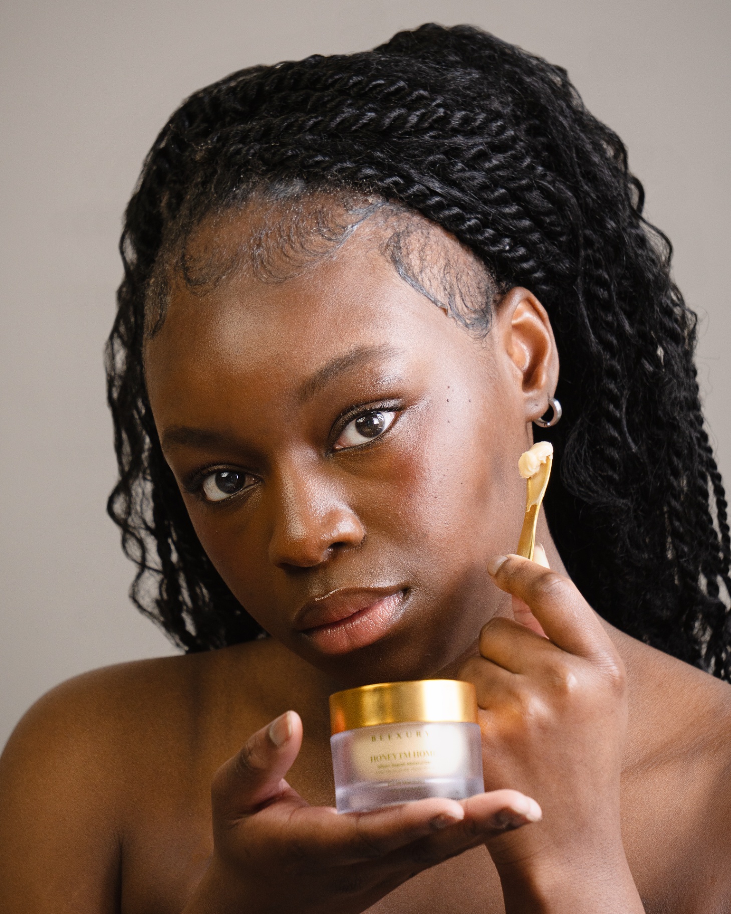 Model applying the Beexury Honey I'm Home silken repair moisturizer